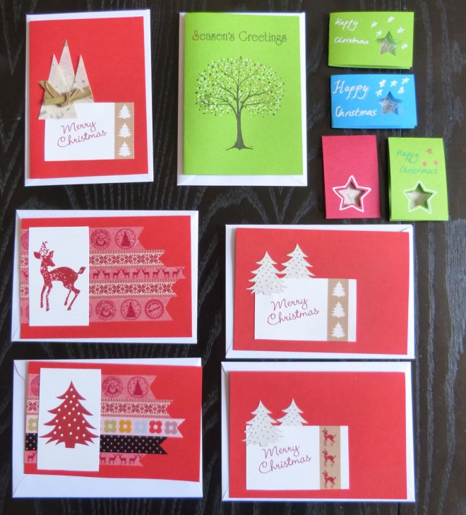 A selection of mostly red hand-made Christmas cards
